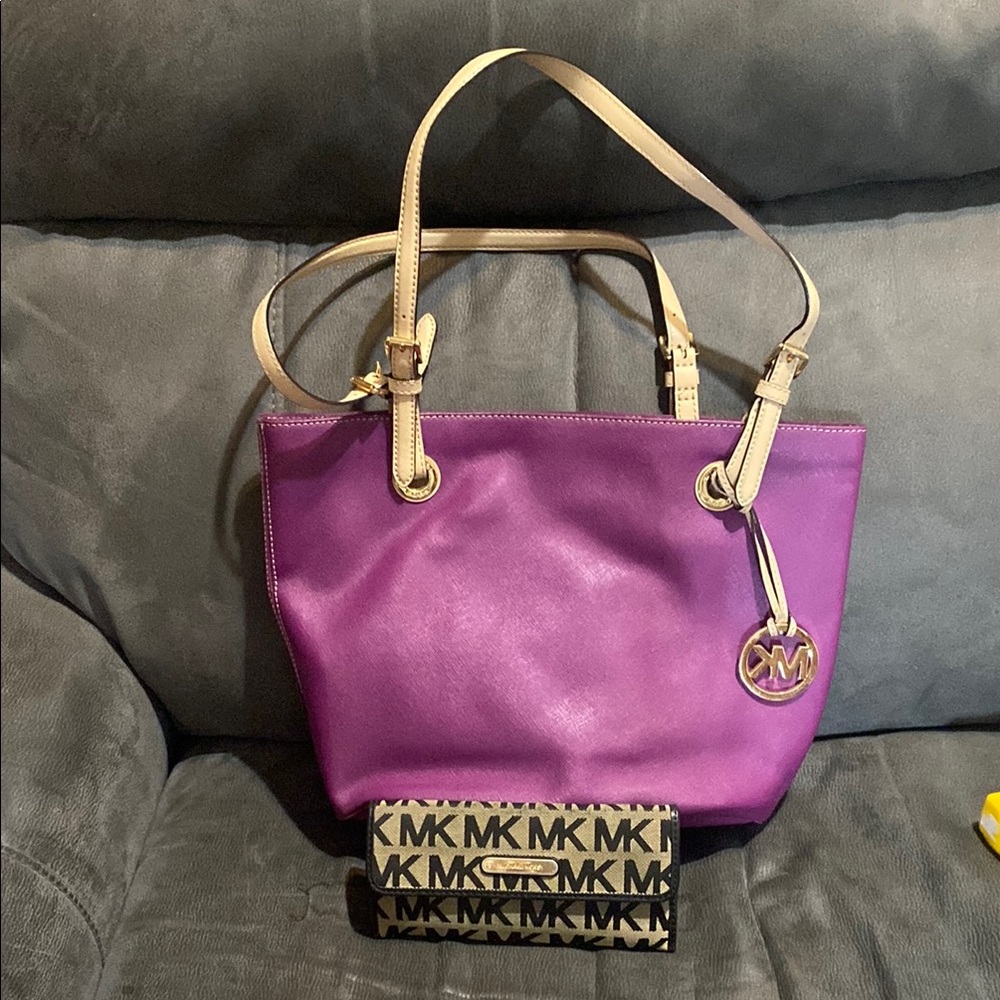 Michael Kors Purple Purse with a Brown and Black Wallet